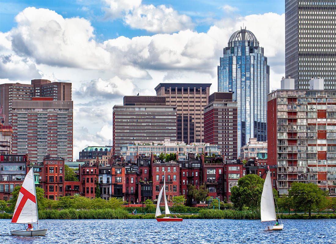 Contact - Boston Skyline Viewed From the Charles River With Sailboats on a Cloudy Day